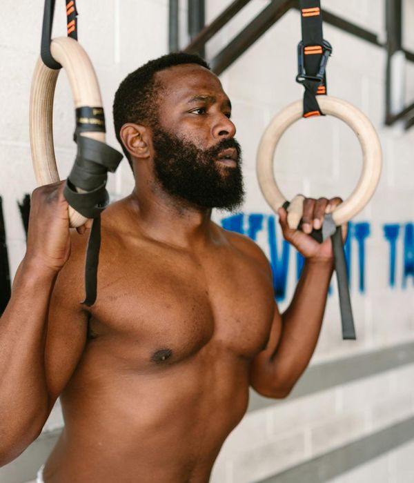 A strong man focusing on his functional training routine.